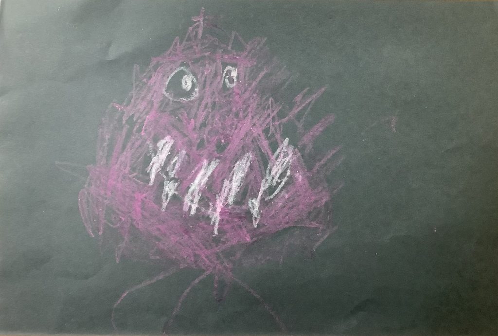 Caitlin's artwork from Hoyland Springwood Primary School, showing a pink monster that is smiling. 